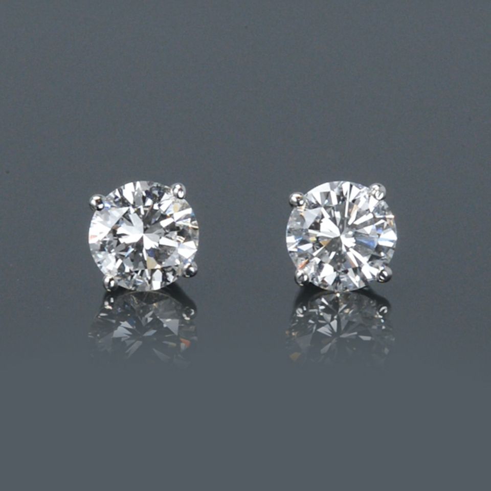 One Pair of Round Diamond Ear Studs 1.12 carat cttw containing 0.58 carat D/VVS1 EGLUS & 0.54 carat E/VVS2 EGLUS Set in 14K White Gold