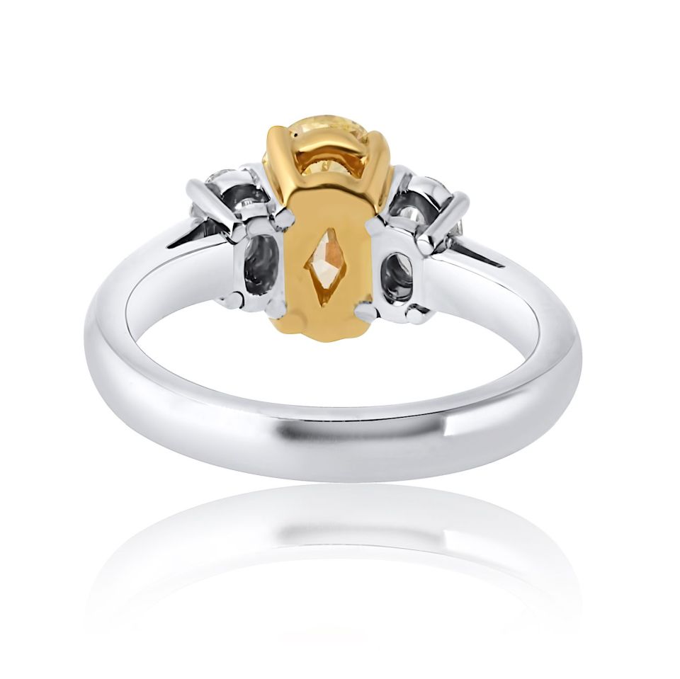 1.54 carat Oval Diamond Fancy Intense Yellow Three Stone Diamond Engagement Ring