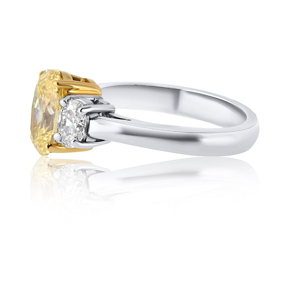 1.54 carat Oval Diamond Fancy Intense Yellow Three Stone Diamond Engagement Ring