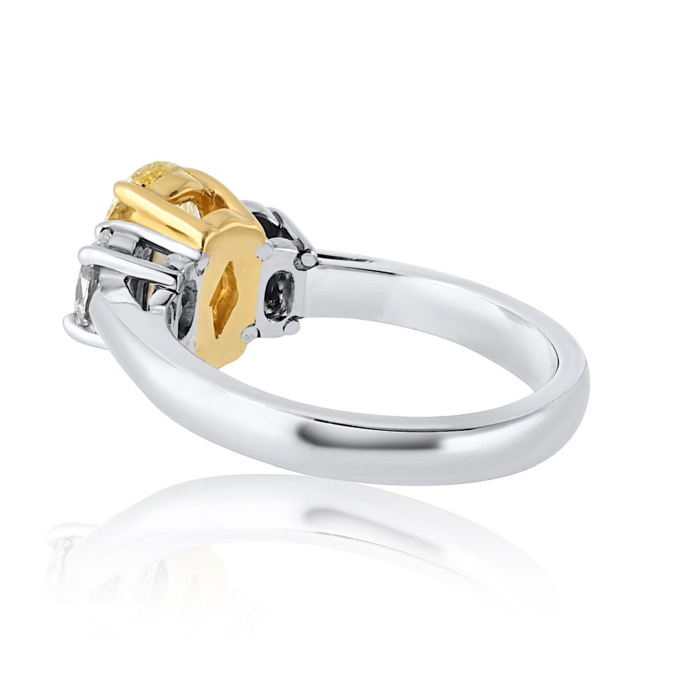 1.54 carat Oval Diamond Fancy Intense Yellow Three Stone Diamond Engagement Ring